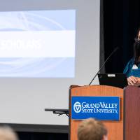 Speaker wearing mask giving opening statement.